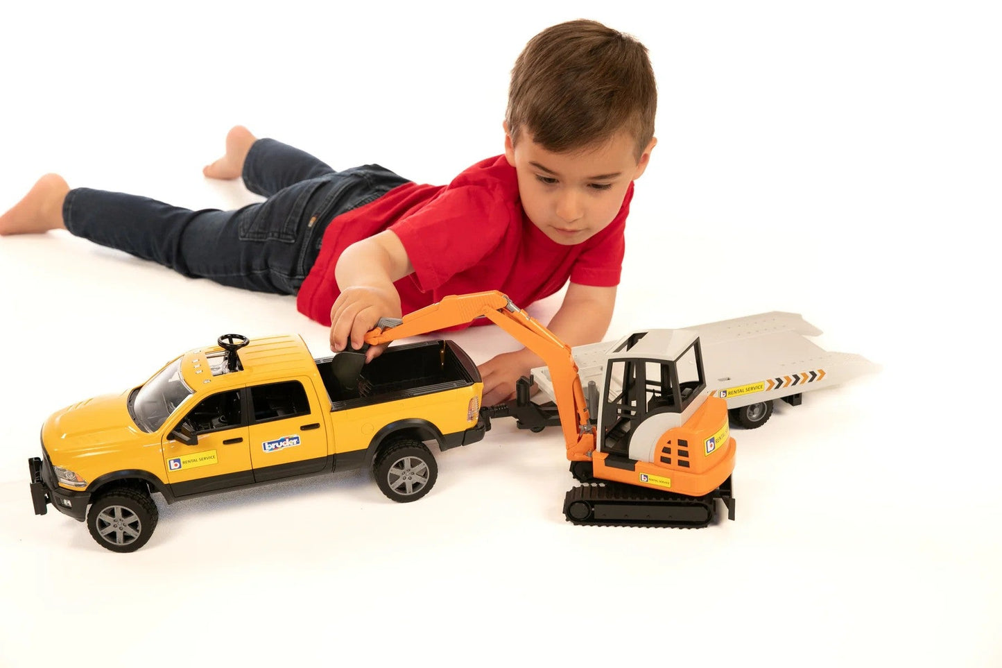Bruder Toys America Play Vehicles Bruder Ram Rental Service with Mini Excavator