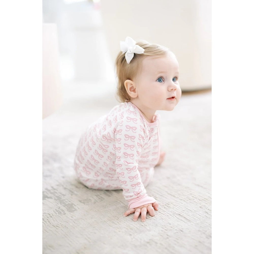 The Uptown Baby Girls Apparel / Sleepwear / Infant The Uptown Baby Pink Bows Long Sleeve Romper