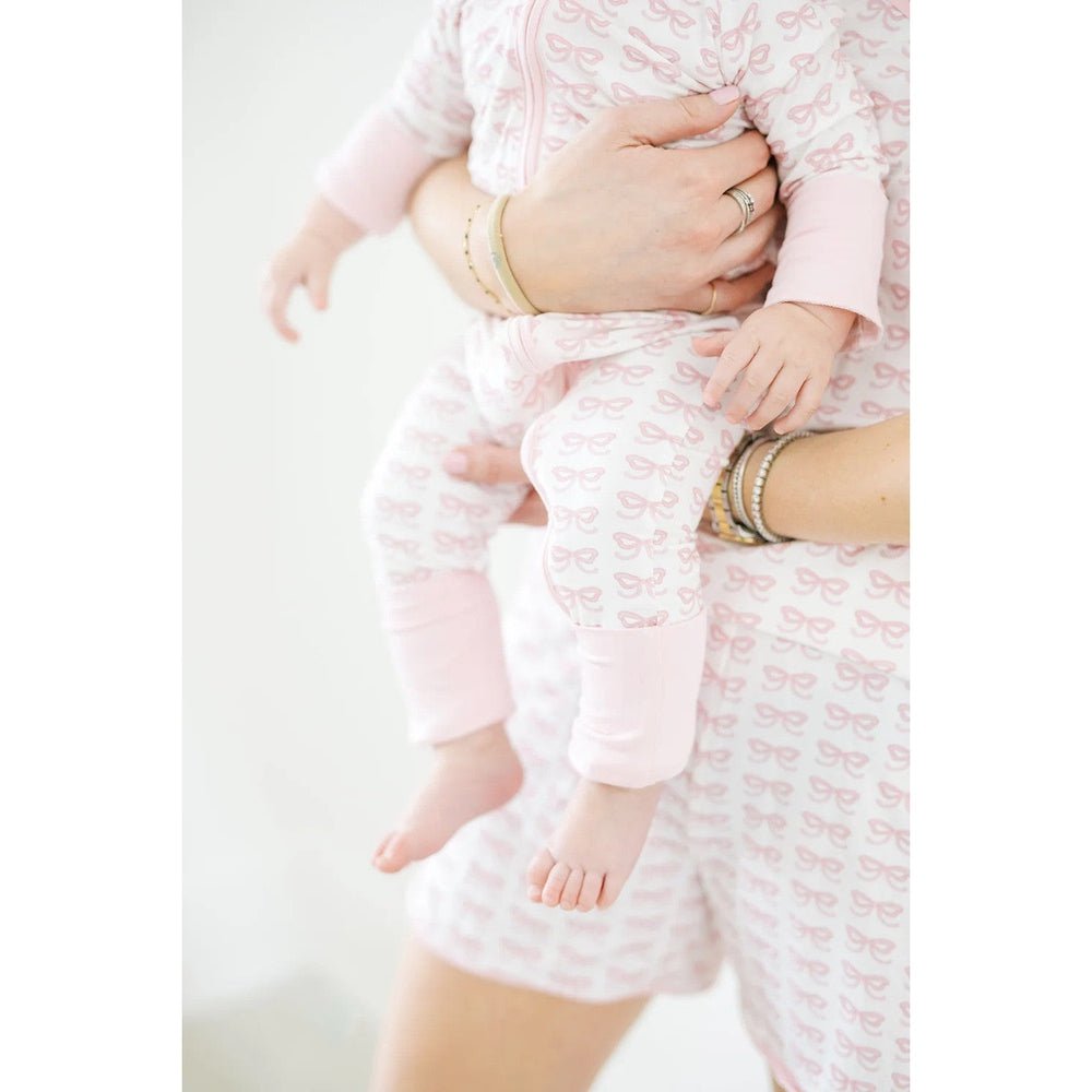 The Uptown Baby Girls Apparel / Sleepwear / Infant The Uptown Baby Pink Bows Long Sleeve Romper